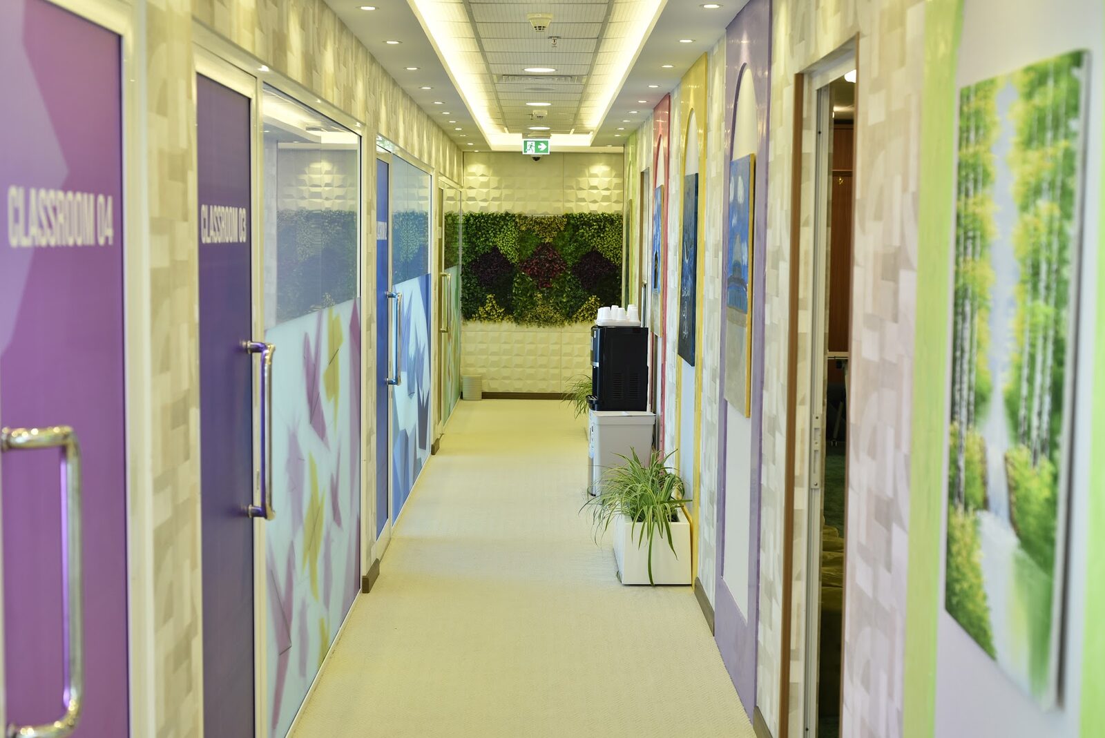 Corridor leading to Classroom 03 and Classroom 04 with a living green wall