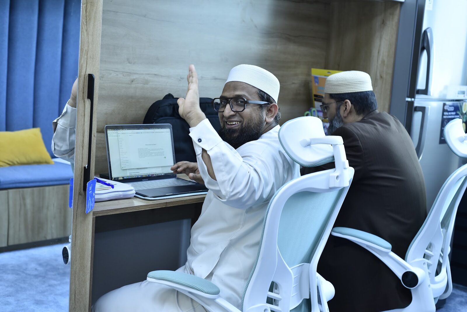 Faculty Lounge workstations with mentors at their desks