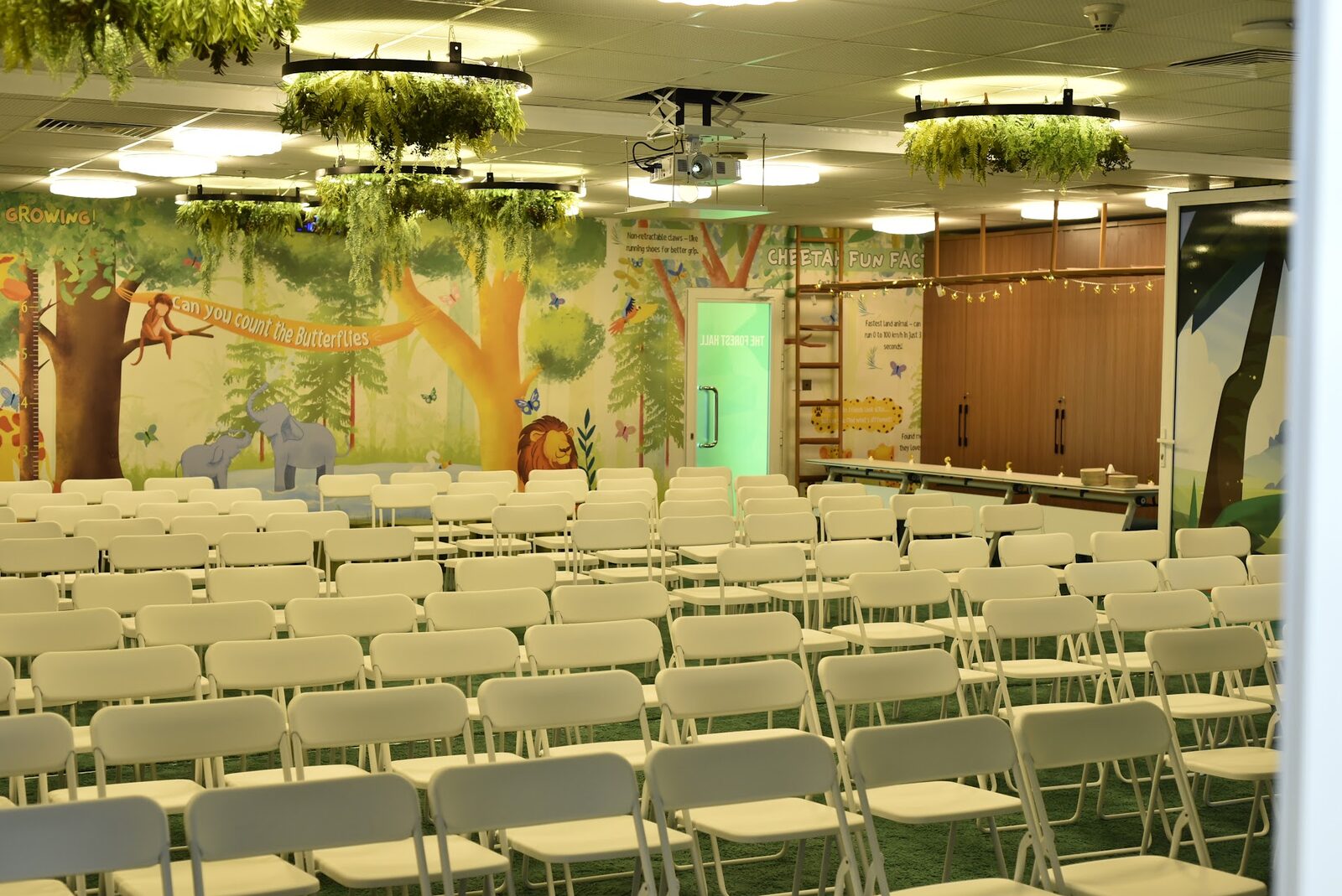Forest Hall with cheetah fun facts wall and jungle greenery