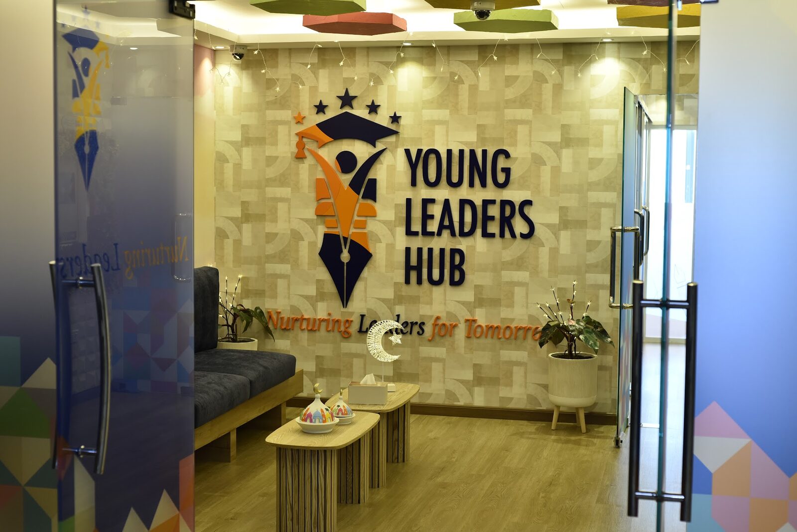 Reception area with the Young Leaders Hub logo wall