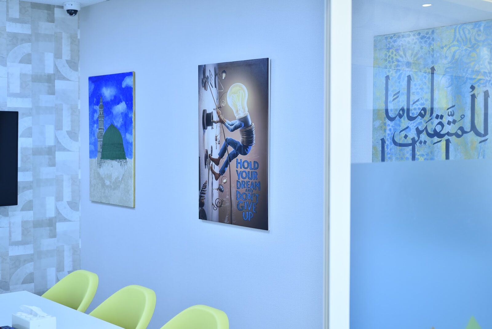 Inspirational wall art including a 'Hold Your Dream' poster