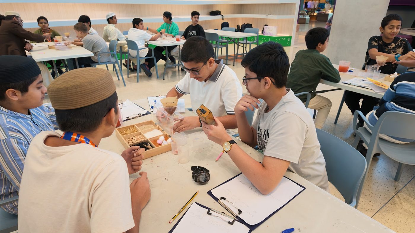 Students doing a hands-on chemistry experiment with filters and samples