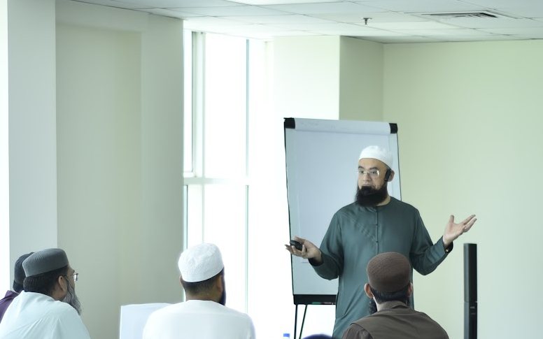 Trainer leading a faculty leadership and excellence workshop