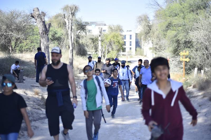 Group making their way up the sandy desert track