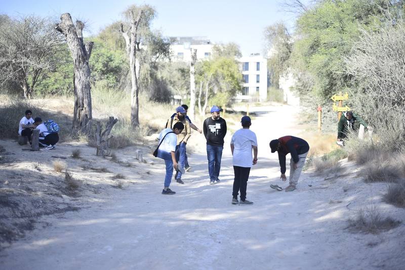Fathers and sons regrouping partway along the trail