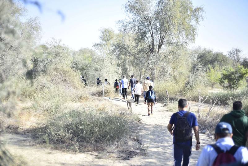 The group heading off down the trail into the trees