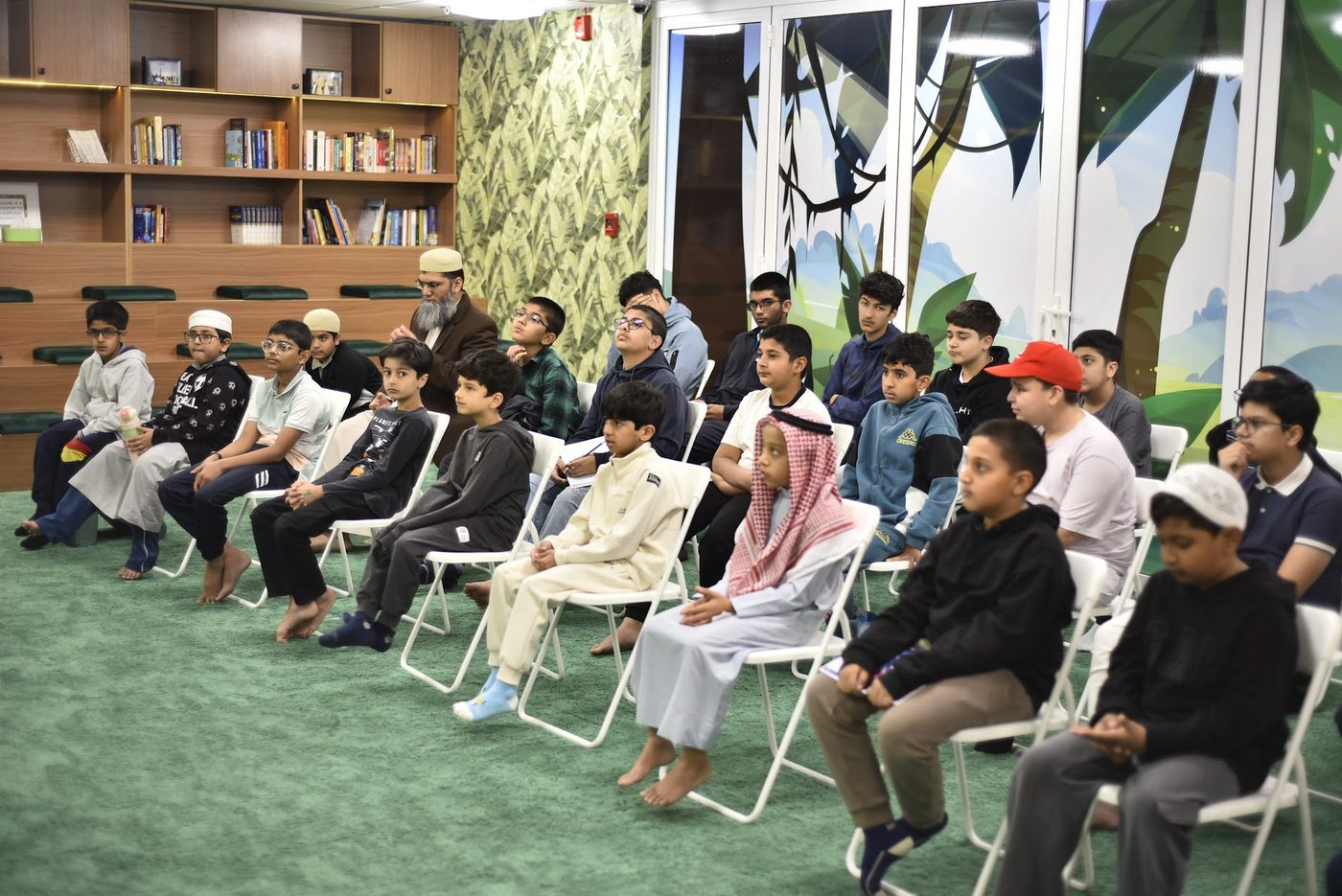 Students seated in the library for the talk