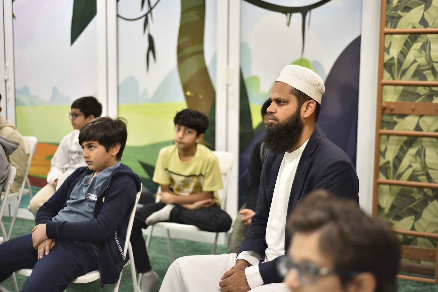 An attendee listening attentively during the talk