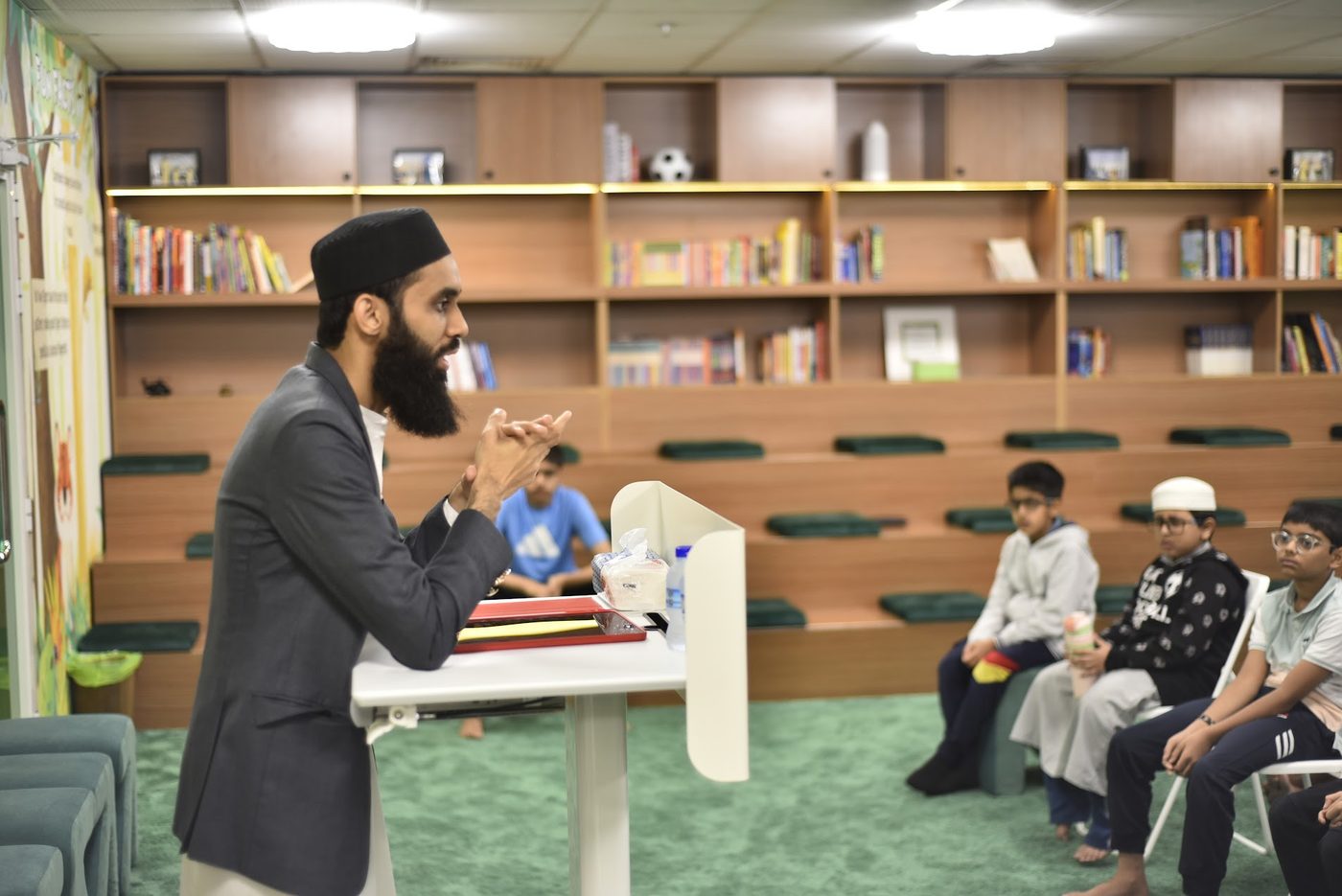 Speaker explaining a concept from the podium in the library