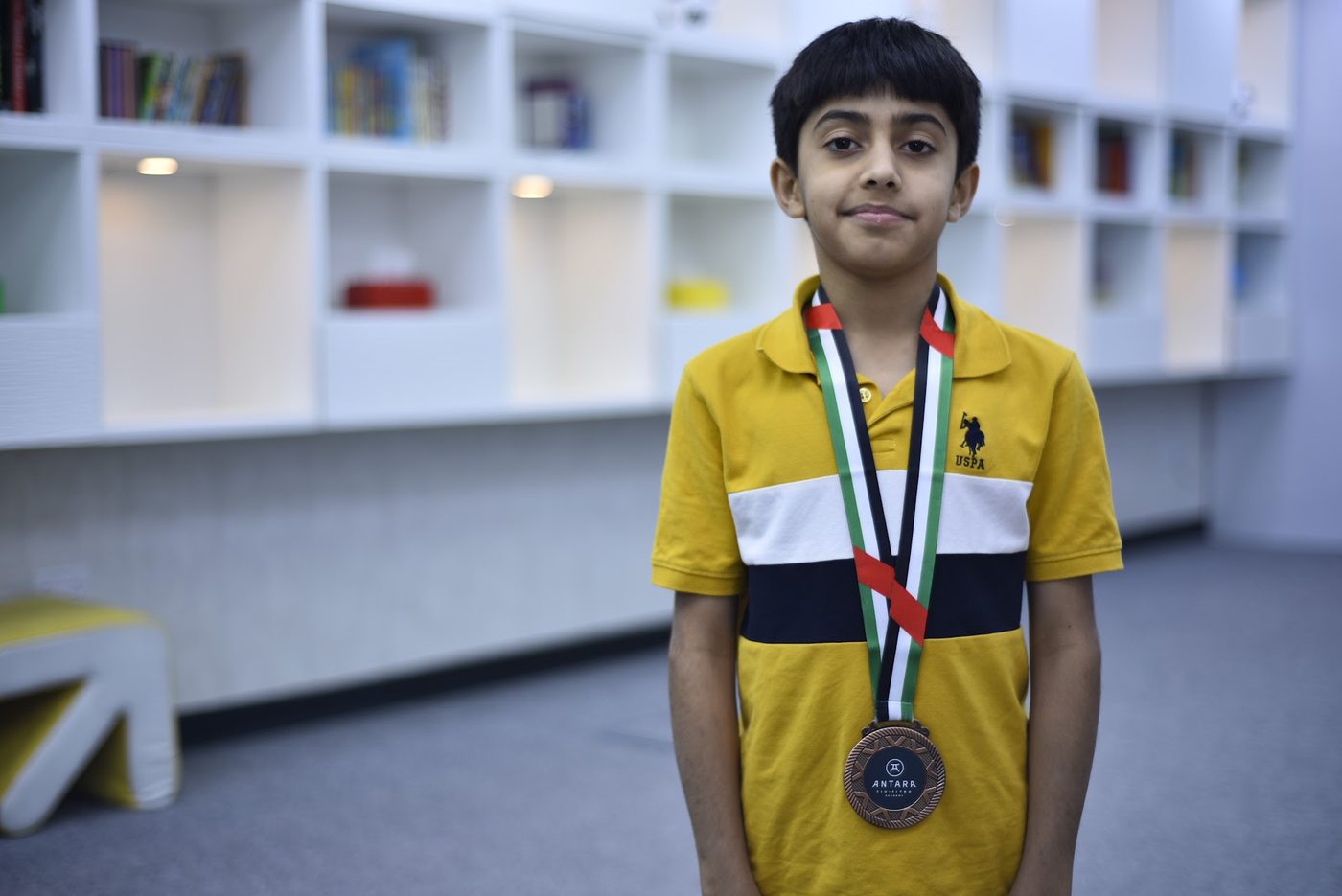 Young Jiu Jitsu competitor wearing a bronze medal