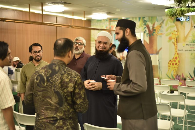 Parents chatting over coffee after the talk