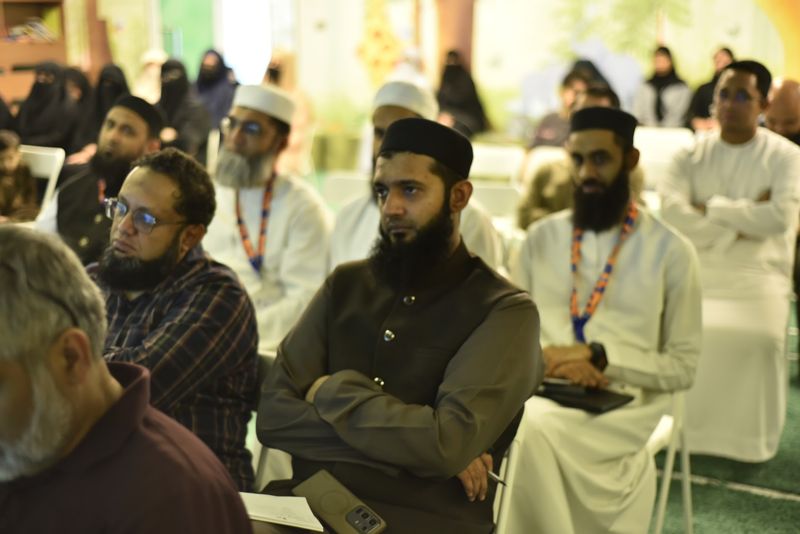 Fathers listening attentively during the session
