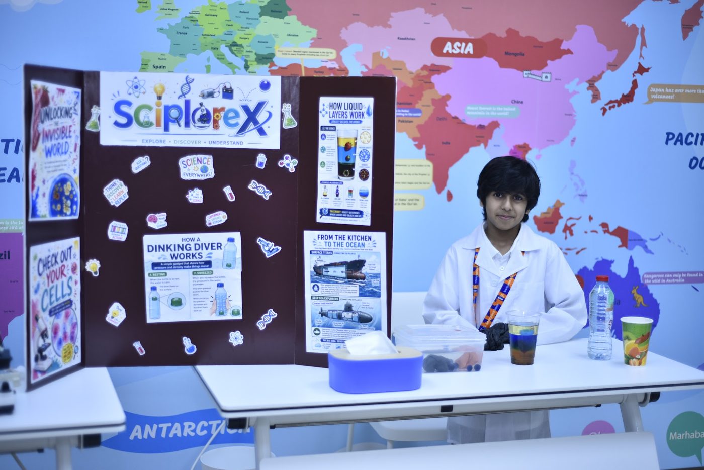 Student presenting his Sciplorex science project on density and logical thinking