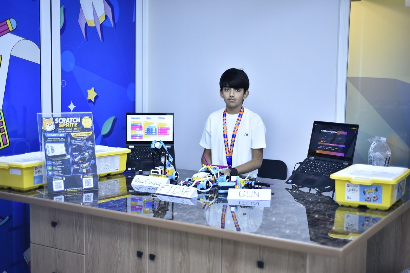 Student presenting LEGO SPIKE Prime builds and Scratch coding projects